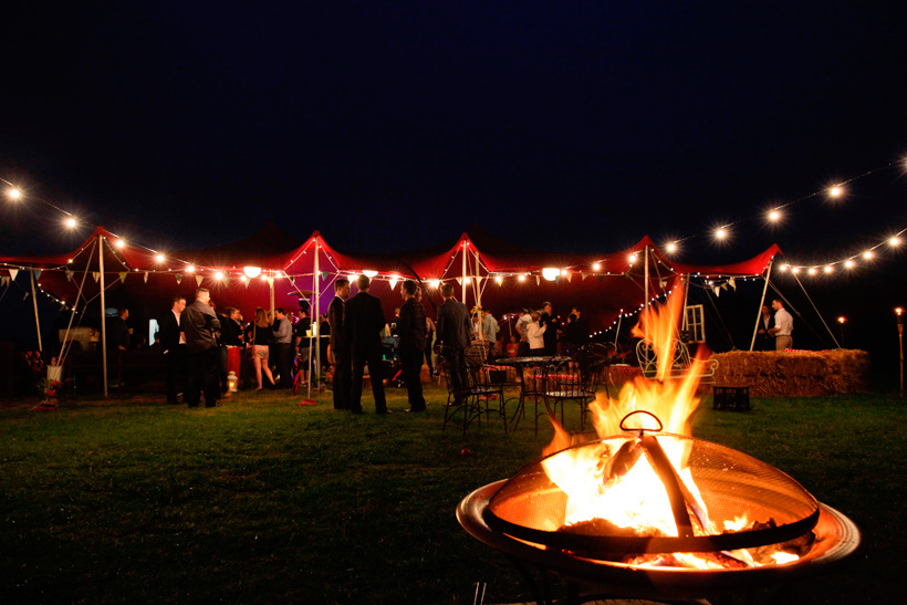 weddings at maleny retreat night time, marquee hire, red marquee, fire